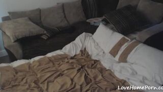 Teen in a bed masturbating and watching porn